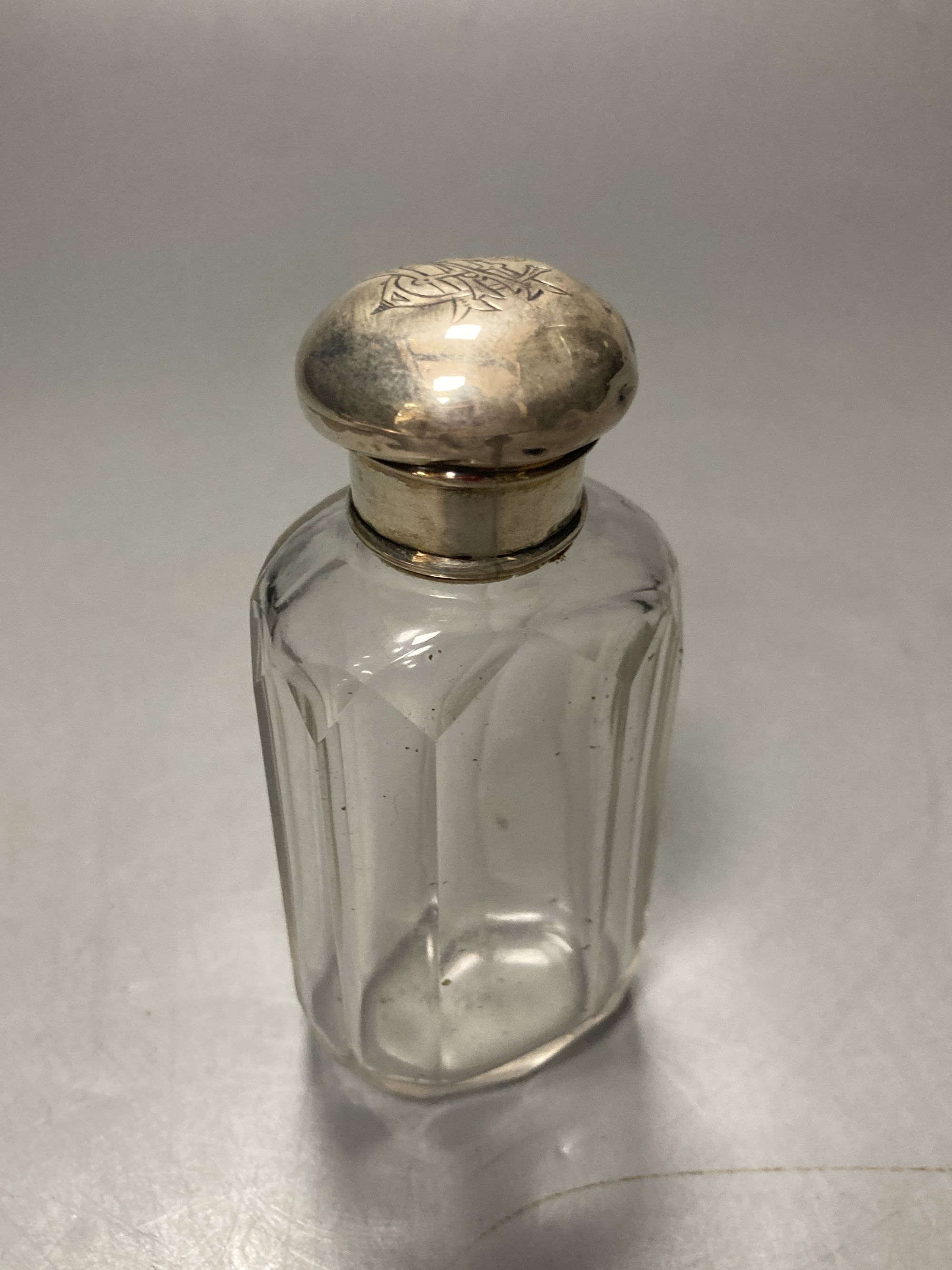 Three silver mounted travelling jars, two in a case, largest 17.1cm,